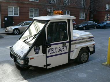 NYU campus security has upgraded their patrol vehicles to this Smart Car, an eco-friendly hybrid that keeps officers warm and dry on patrol.