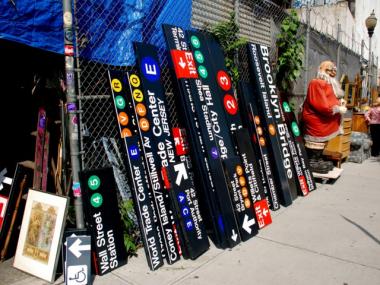 Subway signs sit out front of Billy's Antique and Props on E. Houston Street.