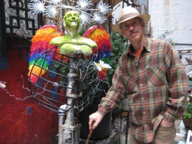 The artist, David Scalza, in his sculpture.