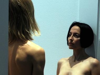 In the 'Marina Abramovic: The Artist is Present' exhibition at the Museum of Modern Art, patrons must pass between two nude models.