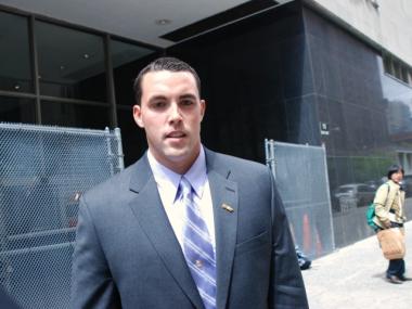 Former NYPD officer Patrick Pogan outside a Manhattan courthouse where he is standing trial for allegedly shoving a Critical Mass biker and lying about the incident in 2008.