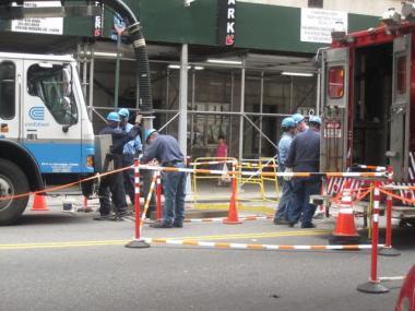 ConEd Crews work on two manholes on East 79th Street between Madison and Park Avenues Tuesday after an explosion left the north side of the block without power.