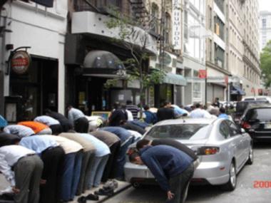 Muslims pray outside Masjid Manhattan's temporary location at 20 Warren St. The mosque wants to build a new home near the World Trade Center site.