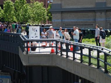 Crowds gather to check out a public art display at the High Line.