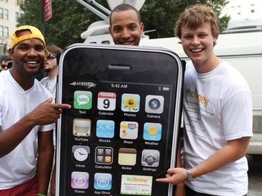 Yeury Marte, 22, Odarius Turner, 24, and Jason Weber, 24, from Manhattan, all promote YouRenew.com, a company that buys old phones.
