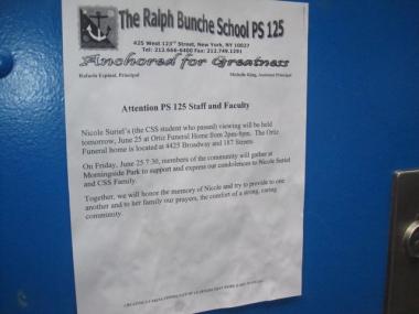 A sign on the school door with news of Nicole Suriel's memorial.