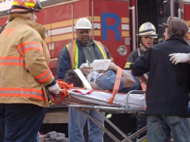 Rescue workers respond to the collapse of a high-rise crane under the operation of Rapetti Rigging Services in March 2008. Seven people were killed.