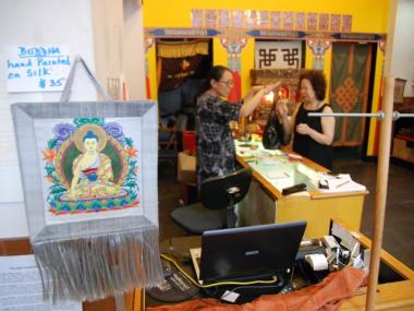Owner Perloo Choden talks to customer Maria Gibson at Tibet Bazaar. The Amsterdam Avenue store is closing at the end of the month after 18 years in business.