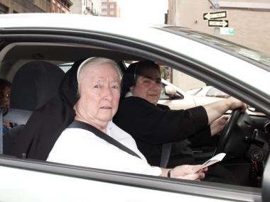 The shocked nuns in their car with the ticket.