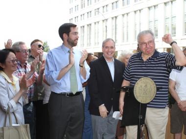 Tenant Ed Rosner, right, celebrated the rent-stabilization decision on Tuesday with local elected officials. Rosner has been fighting since 2006 for tenants and the federal government to be reimbursed for rent overcharges at IPN.