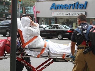 An employee that witnesses identified as Madeleine Sierra was brought to Bellevue Hospital in a Haz-mat suit after opening an envelope filled with white powder in a Midtown Emblem Health building.
