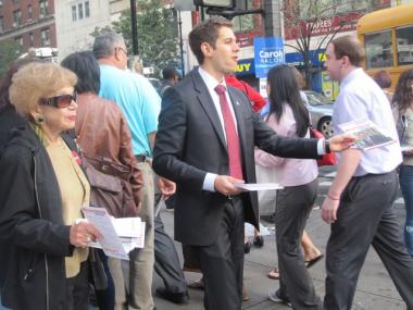 Across the street from Saujani, Republican Ryan Brumberg campaigned with his grandmother Edith Rappy, who is in her 80s.