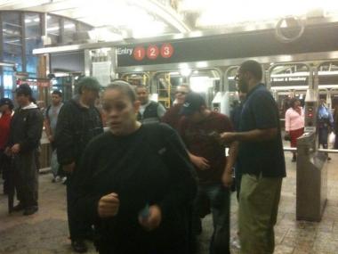 Throngs of straphangers exited 96th Street after flooding forced the MTA to suspend 1, 2 and 3 train service.