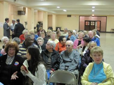 An audience of mostly seniors waits for Congresswoman Carolyn Maloney and Ryan Brumberg to debate Wednesday night in Queens.