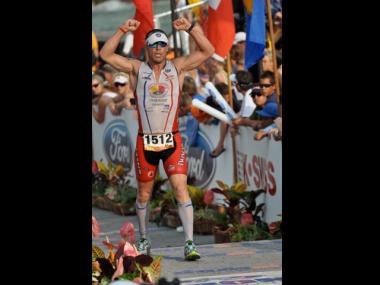 Du Bey at the finish line of the Ironman World Championships last year.
