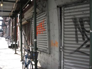 The grills on 502 Canal St. are tagged with graffiti.