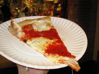 Slice offered at Grimaldi's grand opening Wednesday night — the Chelsea outpost is slated to open to the public in the first week of February.