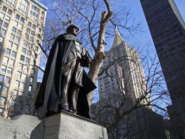 The statue of Admiral David Glasgow Farragut wears a cape in Madison Square Park.