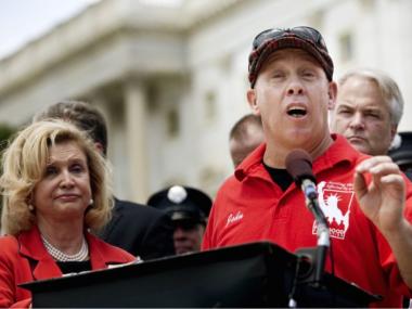 John Feal has been advocating for the 9/11 health bill for years and is shown here at a press conference earlier this year with US Rep. Carolyn Maloney.