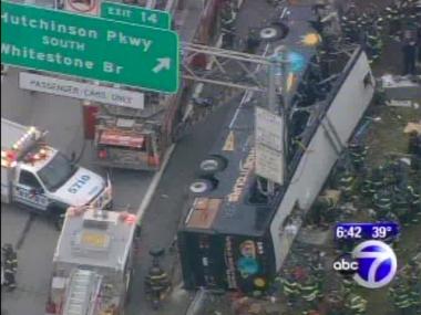The bus lies on its side on a Bronx highway. At least 14 people were killed.
