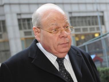 State Senator Carl Kruger, of Brooklyn, turns himself in to federal authorities Thursday in the face of corruption charges. A Manhattan gynecologist, Michael Turano, also turned himself in.