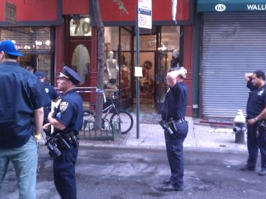 Police gather in front of Pilgrim at 70 Orchard St. Tuesday evening.