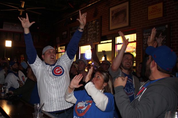  Cubs fans celebrate at Murphy's Bleachers during the World Series. 