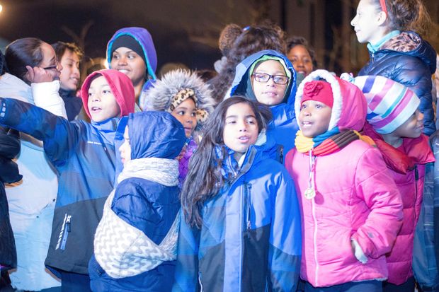  About 50 students, teachers and parents from Rowe Elementary School and  Noble Street College Prep  brought cheer to evening commuters as they sang carols at the Polish Triangle on Wednesday. 
