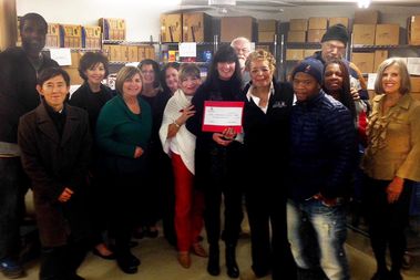  Faculty and staff from Saint Xavier University's School of Education donated $1,000 to the Maple/Morgan Park Community Food Pantry. 