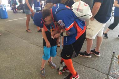  Second baseman Mikey Skoraczewski signs autographs before Clear Ridge's game against Australia. 