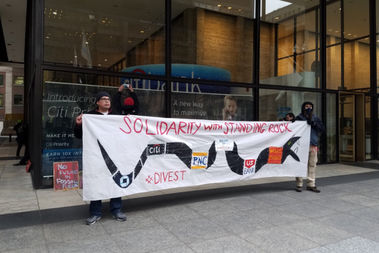 Four people were taken into custody after an anti-Dakota Access oil pipeline protest at Citi Bank.